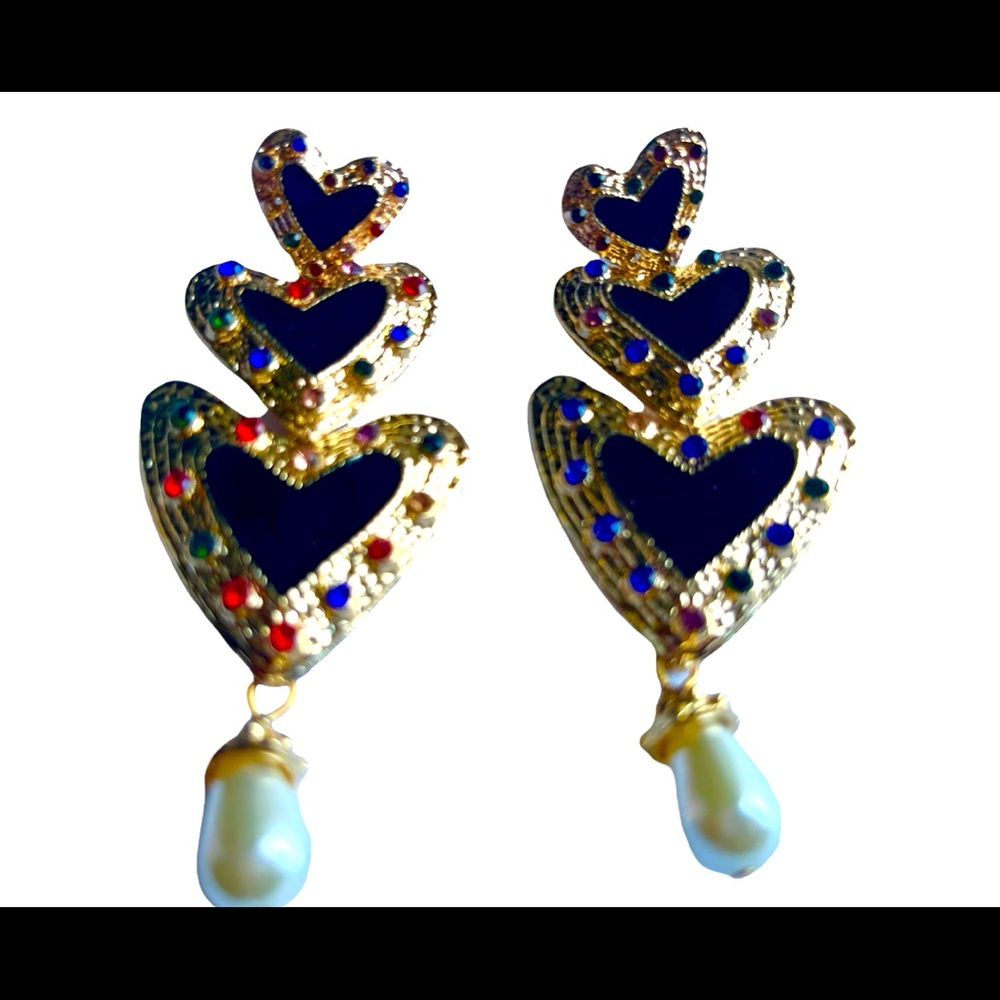 Three heart black and gold earrings.